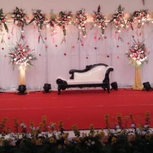 A Dreamy Wedding Stage Overflowing with Romantic Flowers