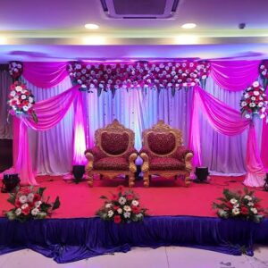 A Regal Celebration Surrounded by Royal Flower Arrangements